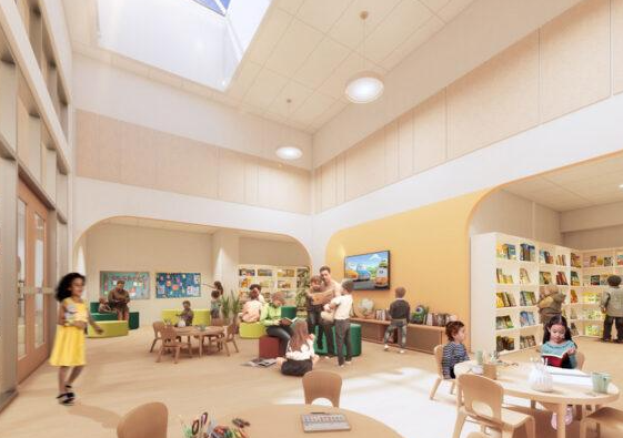 Bright preschool learning and reading space with bookshelves and activity tables